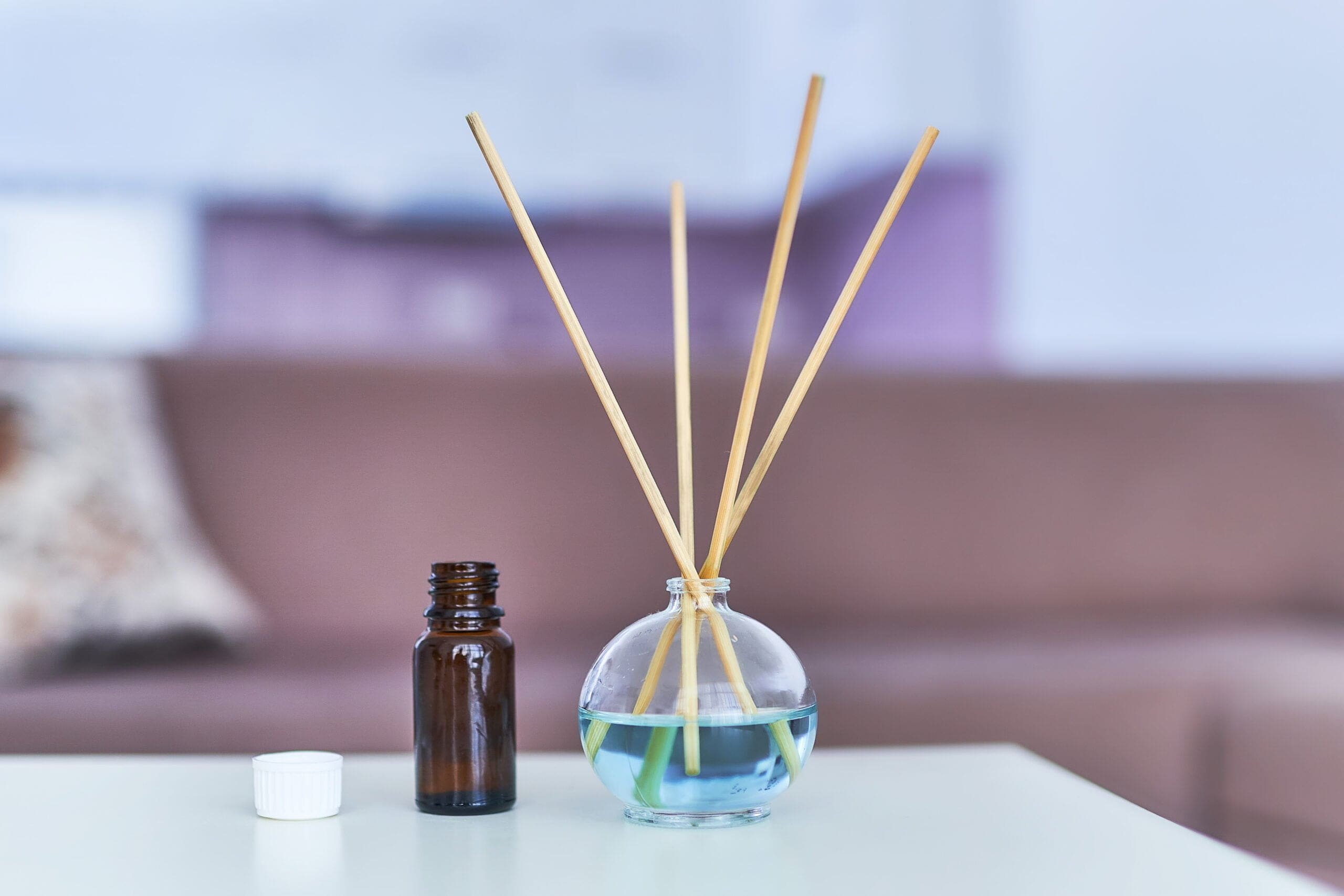 Aroma scent sticks and essential oil bottle in home