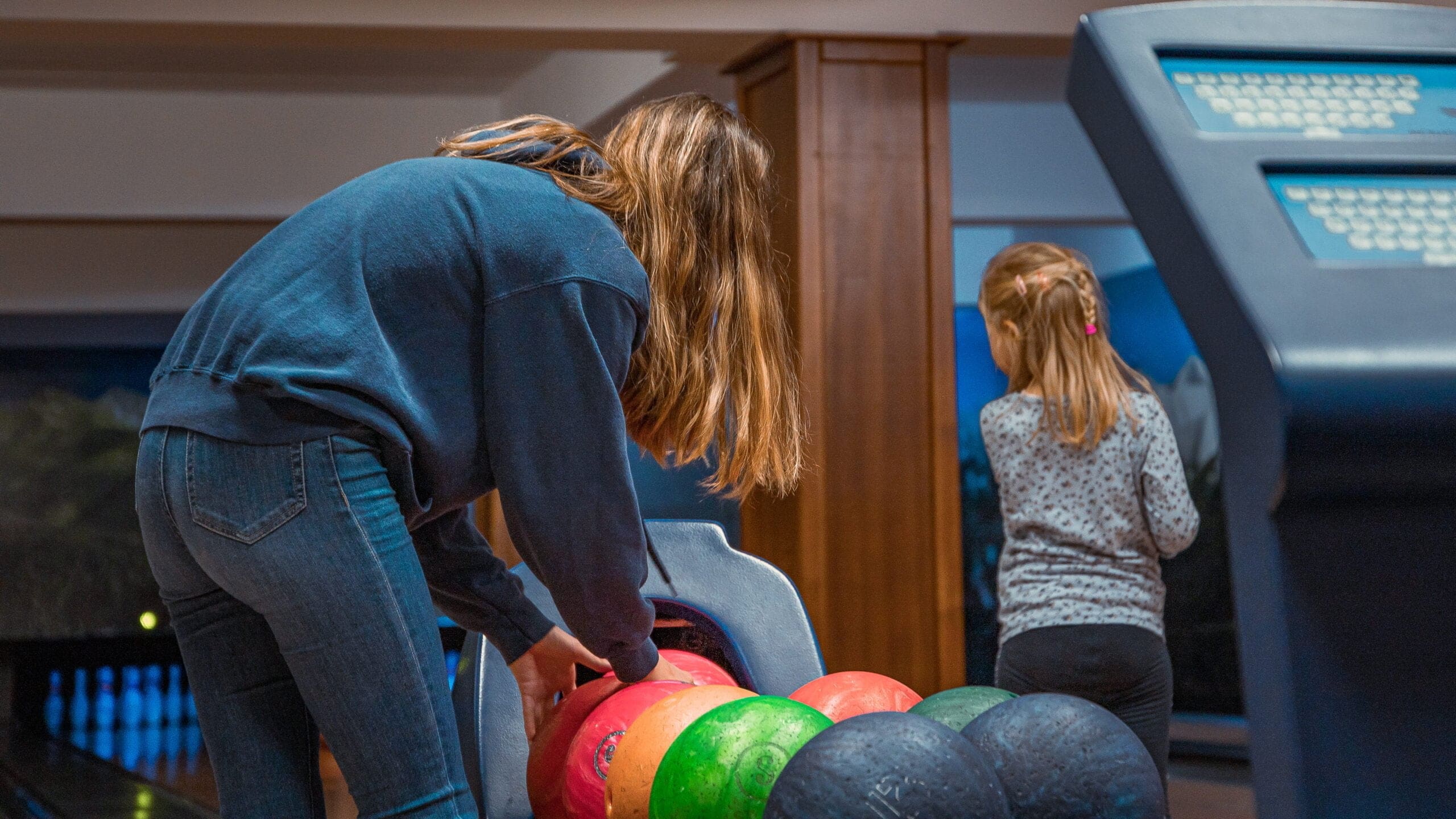 Family having fun bowling