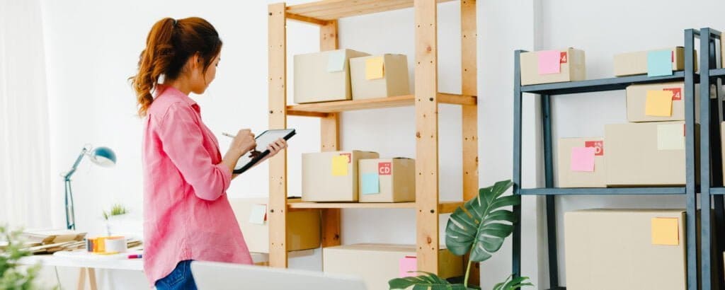 https://heritagecb.com/wp-content/uploads/2021/05/woman-in-garage-organizing-boxes-on-shelves-2-1024x410.jpg