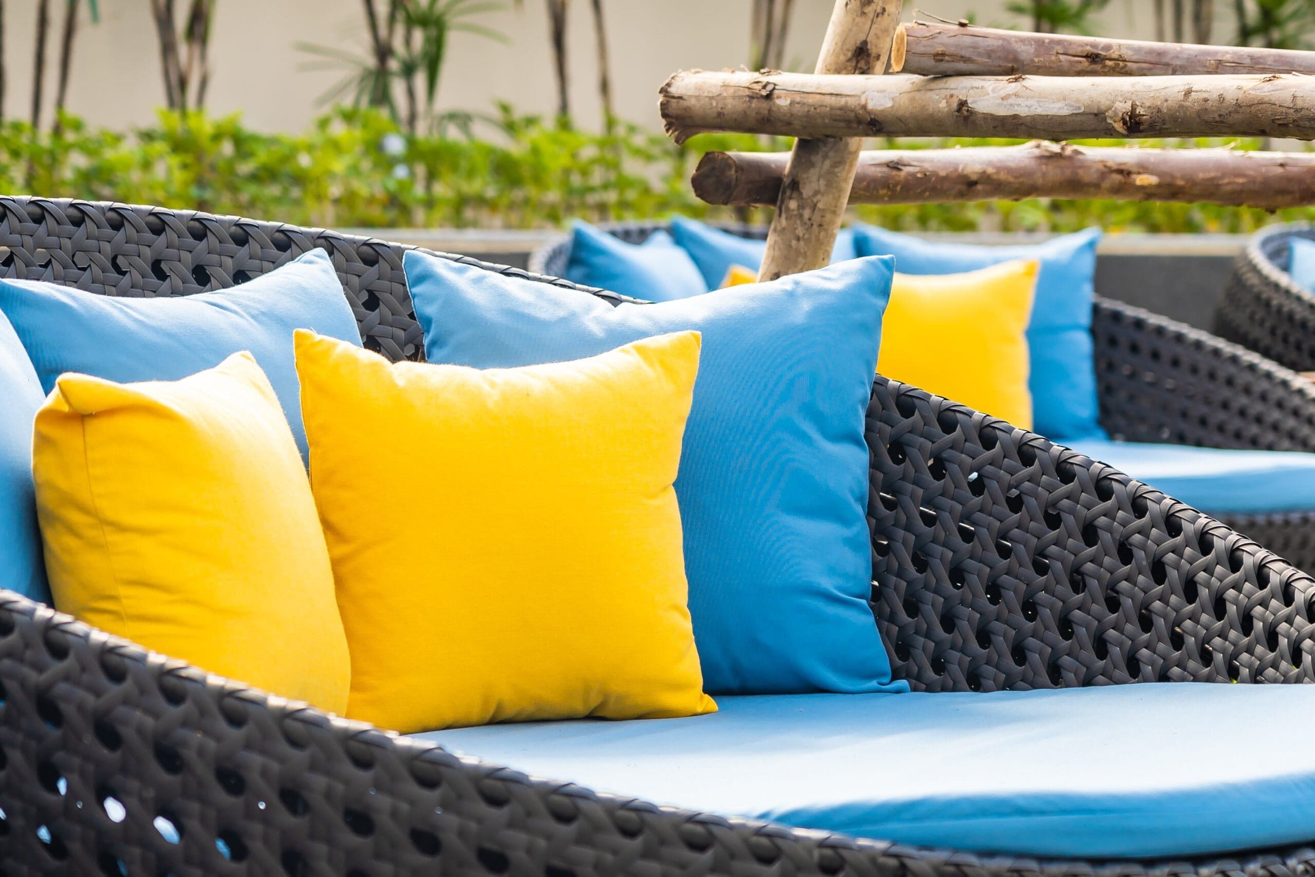 outdoor patio chairs with pillows and cushions.