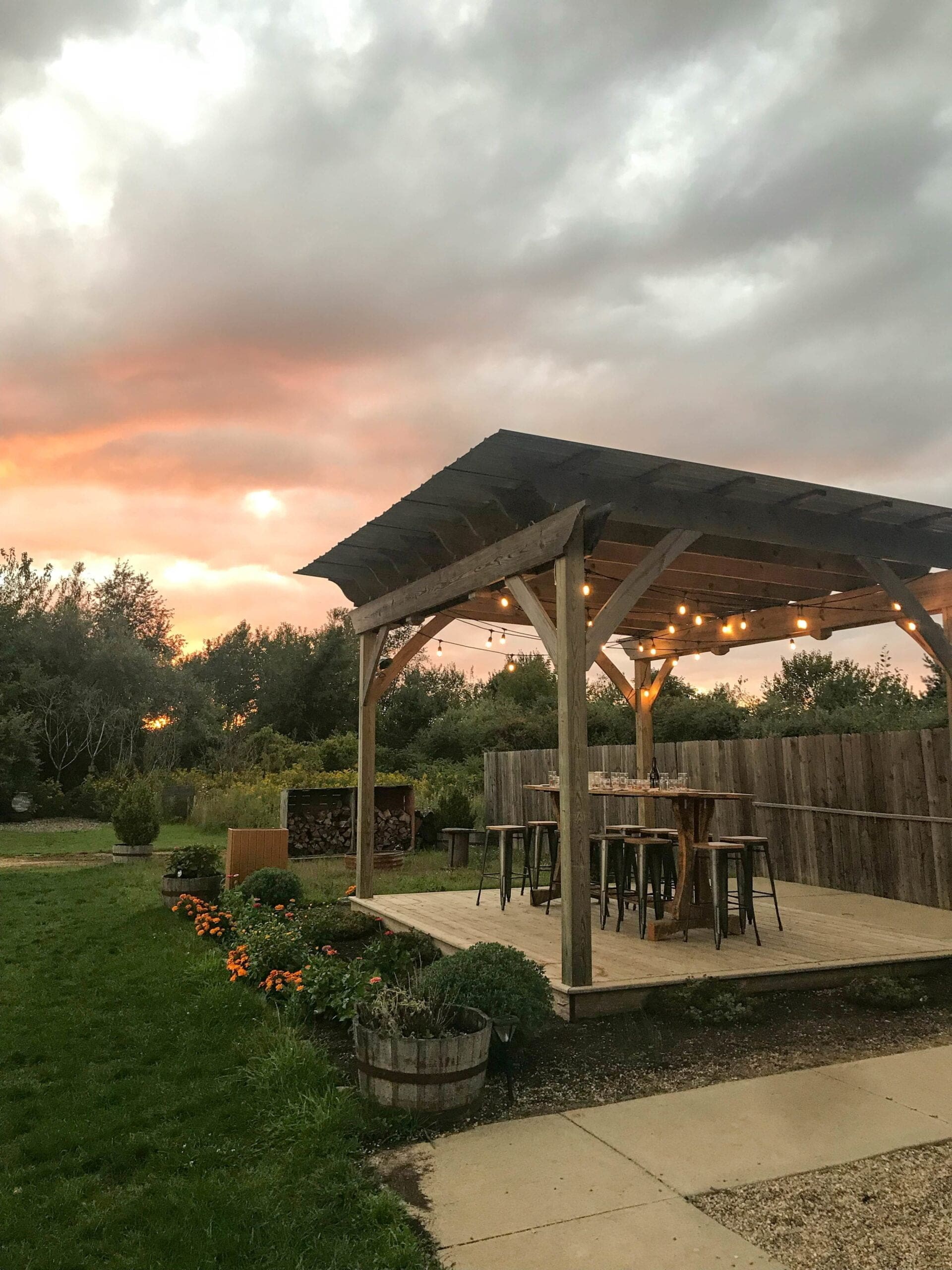 outdoor pergola with lights and landscaping