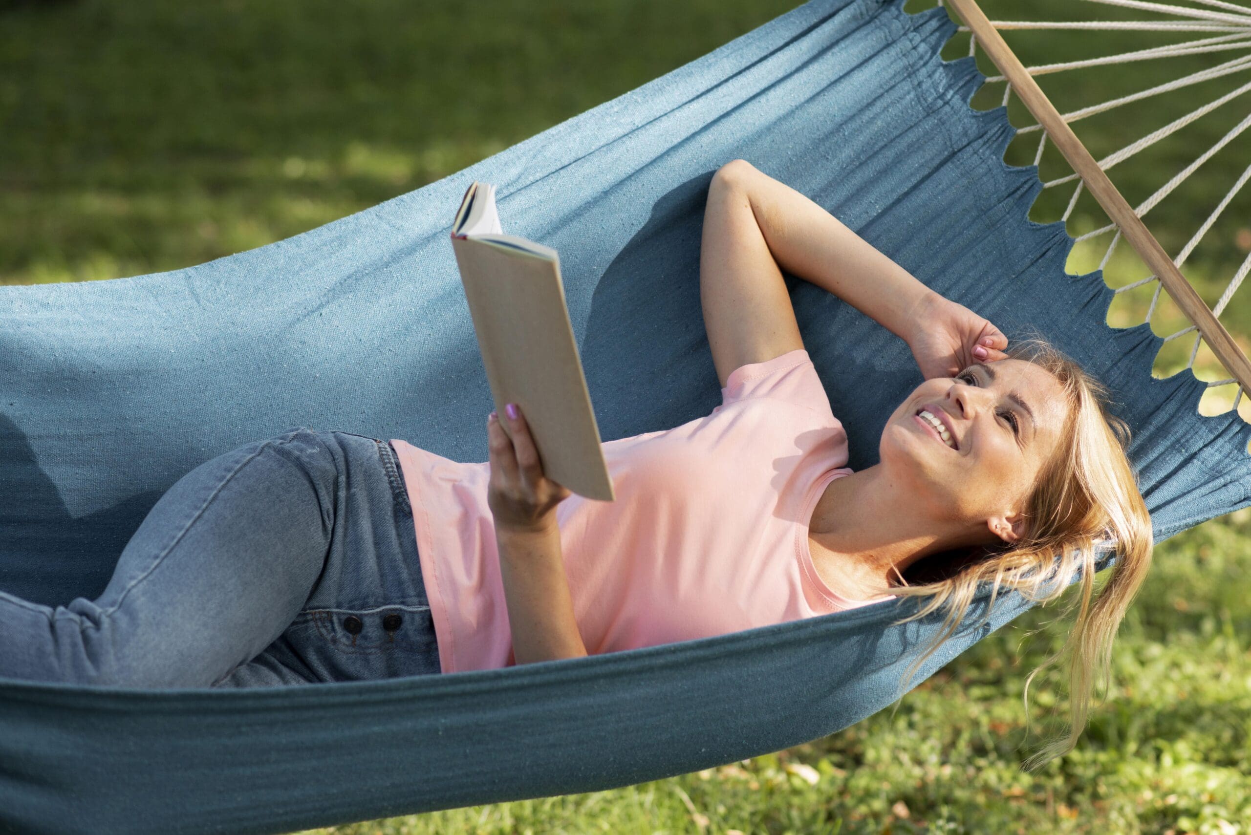 Woman reading in Backyard Hammock