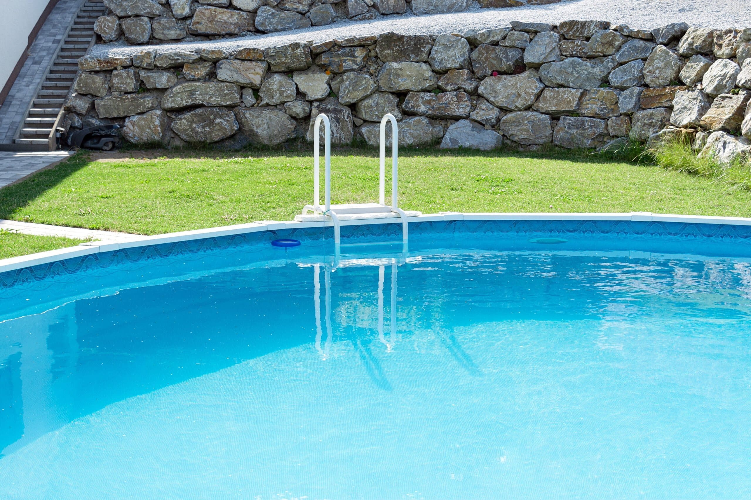 homeowner practice pool safety at home in inground pool