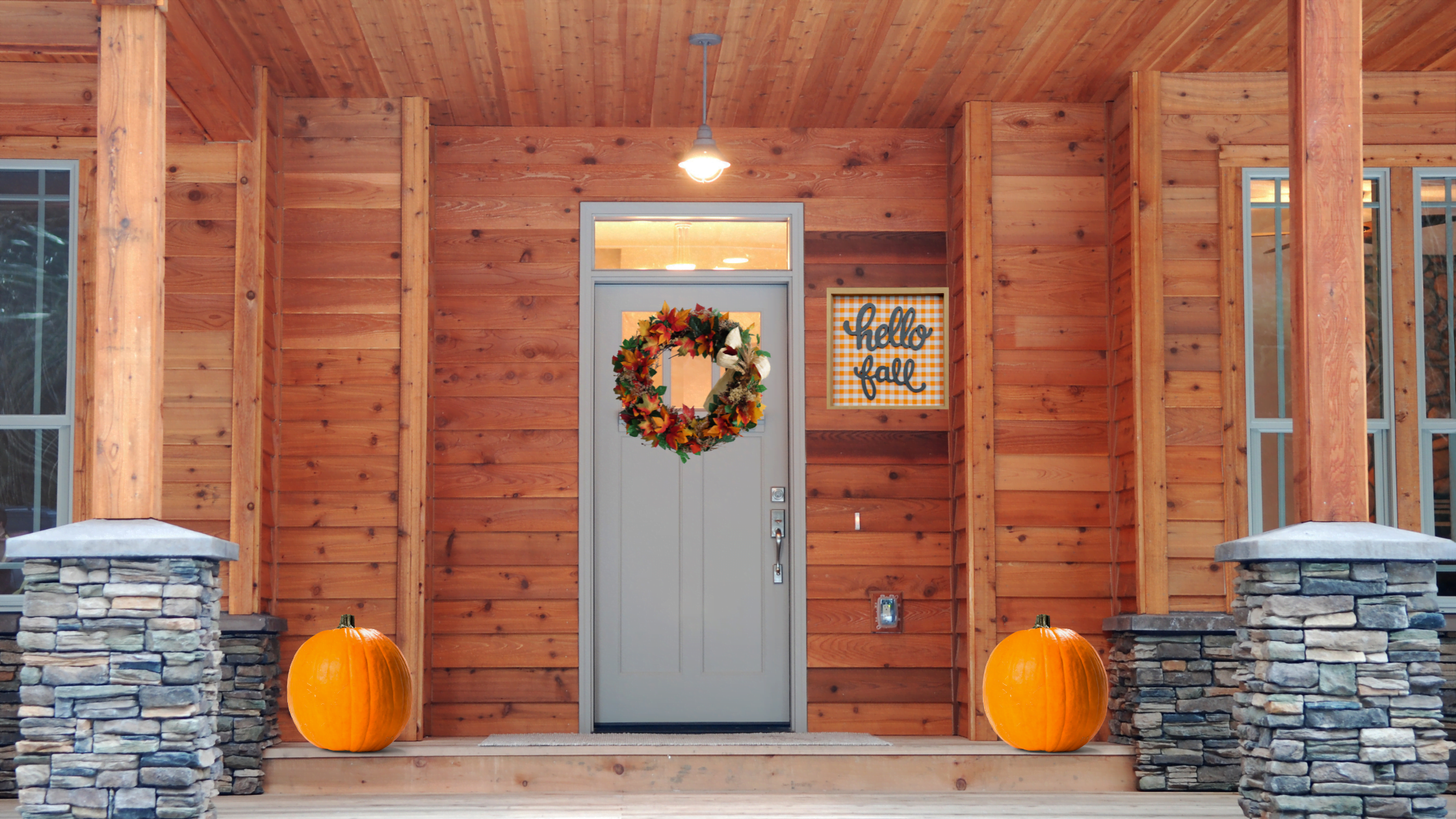 trendy fall sign on outside of house on fall front porch