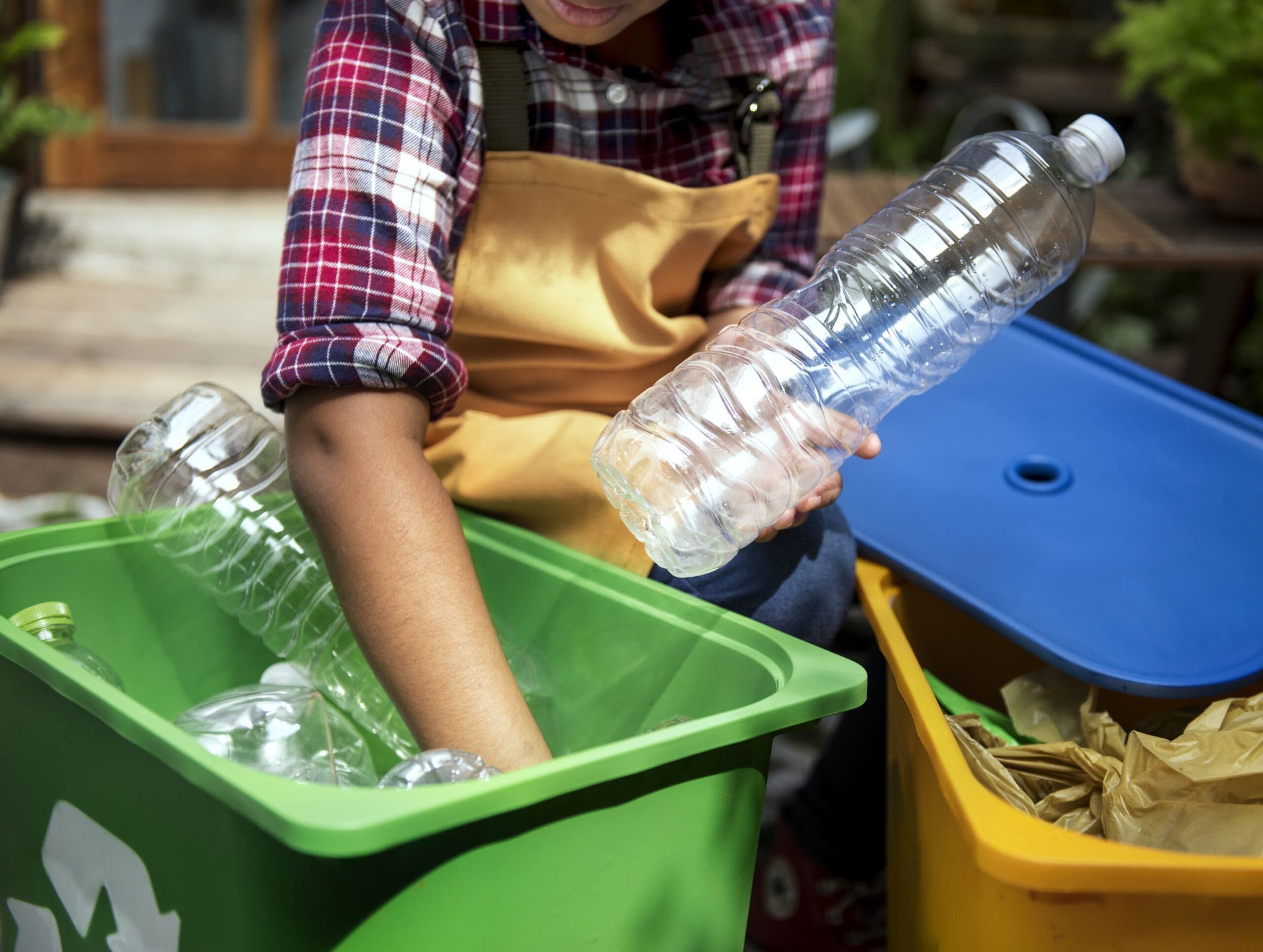 closeup-hands-separating-plastic-bottles-recycling-for-america-recycles-day