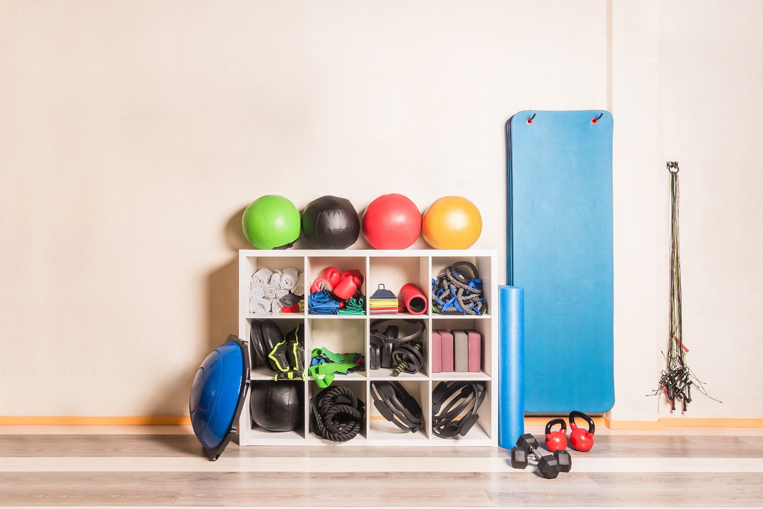 front-view-gym-equipment-arranged-shelves-wall-concept-gym-equipment.