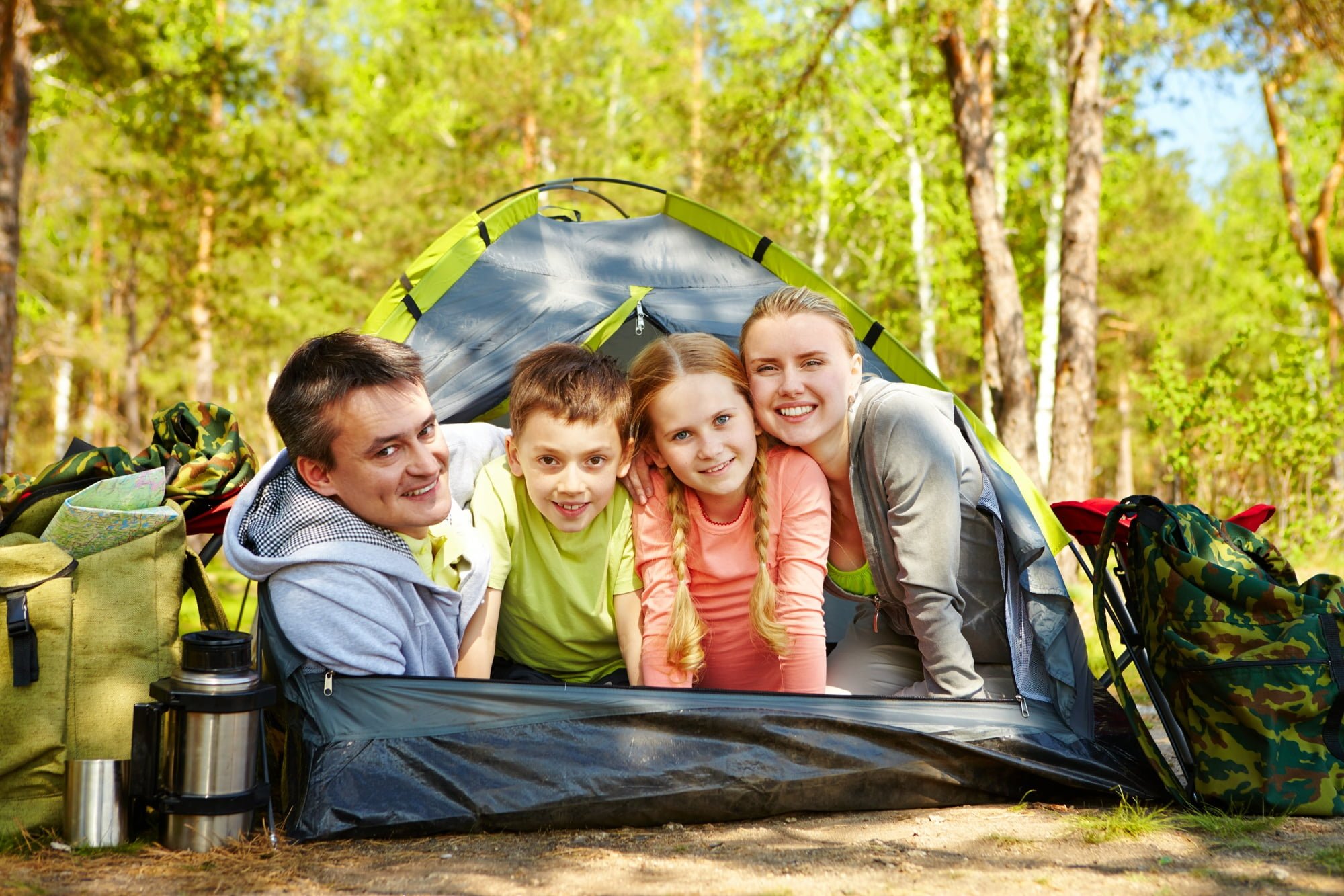 family-backyard-camping-in-tent