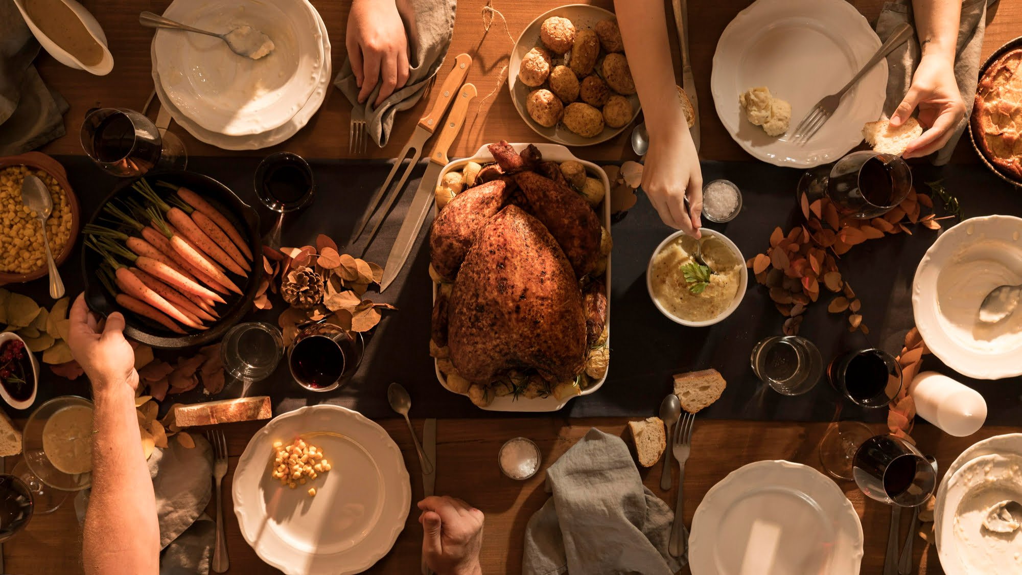 top view of hosting thanksgiving meal spread out on table