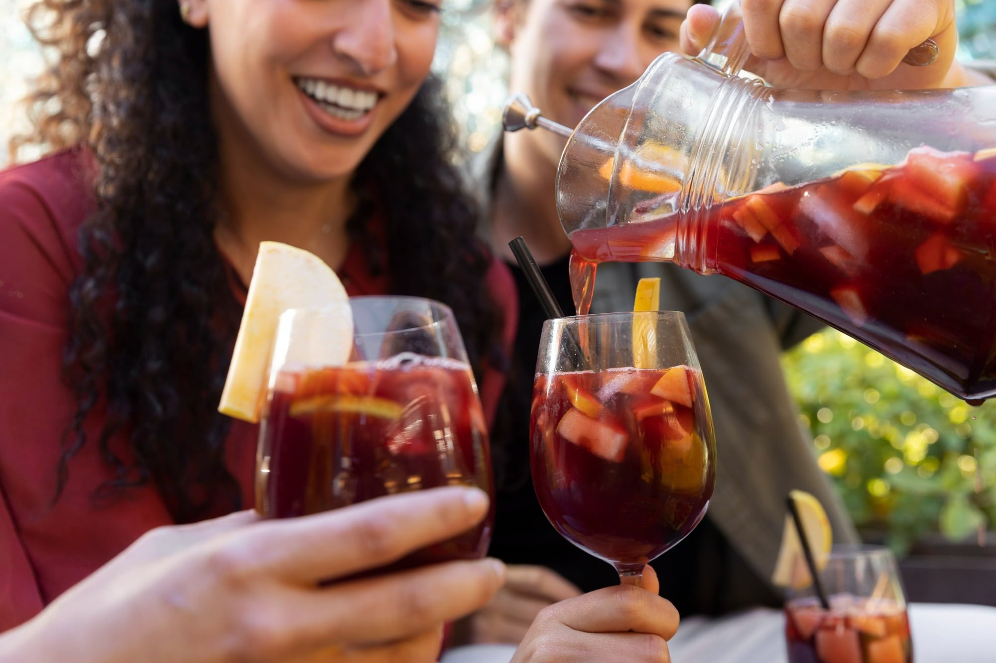 young woman and man drinking sangria from their home recipes for sangria